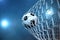 3d rendering soccer ball in goal. Soccer ball in net with spotlight or stadium light background, Success concept