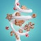 3d rendering of spiral milk splash, caramel candies and assorted gingerbread cookies isolated on blue background. White splashing