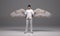 3D rendering : a standing man with a pair of wings at his back pose in white business suit