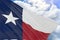 3D rendering of Texas flag waving on blue sky background