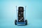 3d rendering of three black casino dice on a hand truck on blue background