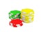 3d rendering of three stacks of gambling chips in green, yellow and red colors on a white background.