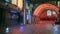 3D rendering of a wet street at night in a futuristic cyberpunk city