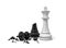 3d rendering of a white chess king standing near a black king figure broken in half.