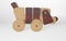 3D rendering wooden children`s toy dog dachshund on wheels