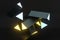 3d rendering, yellow glowing triangle pillar with dark background