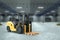 3D rendering, Yellow loader on the background of a large warehouse. The concept of logistics, delivery, transportation, packaging