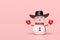 3d snowman with cowboy hat, warm mittens, scarf isolated on pink background. merry Christmas and festive New Year, 3d render