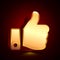 3D stylized Thumb Up icon. Golden vector icon. Isolated symbol illustration on dark background