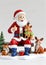 3D Toy Of Santa Claus Enjoying A Snow Picnic With Woodland Creatures On A White Background. Generative AI