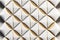 3D wallpaper soft geometry tiles made from white leather with golden decor stripes seamless realistic texture