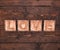 3D Wooden letters forming word LOVE written on wooden background. St. Valentine's Day.