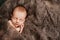 4. Baby asleep on a grey wool blanket at a newborn photoshoot