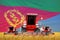 4 bright red combine harvesters on grain field with flag background, Eritrea agriculture concept - industrial 3D illustration