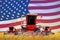 4 bright red combine harvesters on rural field with flag background, USA agriculture concept - industrial 3D illustration