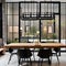 4 A contemporary, urban-inspired dining room with a long wooden table, black metal chairs, and industrial lighting2, Generative