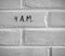 4 A.M. WRITTEN ON WHITE PLAIN BRICK WALL