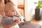 4 months old baby boy infant sitting on her mother, blurred background