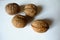 4 ripe brown rounded fruits of Persian walnut