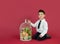 4-year-old boy portrayed with gestures in studio with color background.