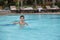 4 years old Asian kid swimming lonely in clean swimming pool