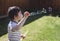 4 years old kid blowing soap bubble wand, Child boy stay at home playing in the garden in sunny day spring during self-isolation