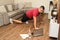 40-year-old dark-skinned Latino man does push-ups to strengthen arms and legs in rehabilitation after fracture and operation