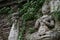 400 years old ruined ancient standing and praying of male angel statue at Chiangmai, Thailand, buddha statue