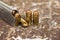 .45 ammunition bullet and gun magazine on rusty background
