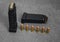 45 caliber hollow point and full metal jacket bullets in magazines and lined up