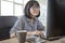 45s years woman working in front of computer monitor office life