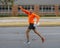 46 year-old Caucasian male leaping into the air playfully after winning his age group in the Turkey Trot 5K in Edmond, Oklahoma.