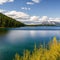 465 Tranquil Lake: A serene and tranquil background featuring a calm lake surrounded by nature in soothing and natural colors th