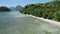 4k Aerial drone flying above shallow clear water circle the paradise tropical beach with coconut palms swinging on the