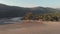 4k aerial drone footage of a beach, at sunset, during a low tide at the tourist destination spot of Palolem, India.