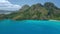 4k aerial drone panorama of mountainous tropical island with jungle and blue lagoons. Exploring El Nido and the Marine