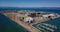 4k aerial drone view of Treasure Island San Francisco bay area surrounded by turquoise blue ocean sea water waves camera move back