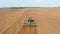 4K Aerial Flat View Tractor Plowing Field In Spring Season. Beginning Of Agricultural Spring Season. Cultivator Pulled