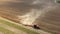 4K Aerial Flat View Tractor Plowing Field In Spring Season. Beginning Of Agricultural Spring Season. Cultivator Pulled