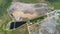 4K Aerial footage. Flying over huge field of trash garbage dump