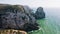 4K Aerial footage of rocky coastline near Praia da Ursa beach and Cabo da Roca located on Atlantic coast in Sintra
