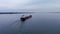 4K aerial footage of a self discharging bulk carrier ship sailing the St Lawrence River.