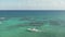 4k Aerial Shot Following a Boat in the Crystal Clear Caribbean Water Near Cancun