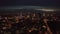 4K. Aerial shot of Warsaw city metropolis skyline at night. Spectacular aerial view of skyscraper city buildings at