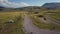 4k aerial shot wooden picnic area and campervans heading into stunning valley