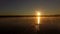 4k aerial - sportsman swimming butterfly at sunset.