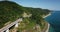 4K aerial stock footage of car driving along the winding mountain pass road through the forest in Sochi, Russia