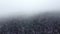 4k aerial video descending above foggy woods