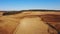 4K. Aerial view of agriculture process: tractors are plows and makes seeding, sowing agricultural crops at field