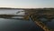 4k aerial view of La petite Camargue vegetation by the river in Saint-Chamas, France under blue sky